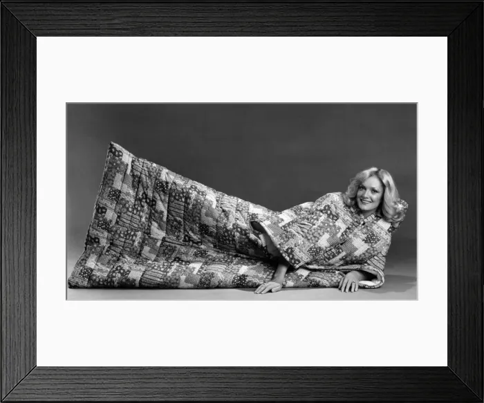 Framed Print : Snuggle Sack for all the family. Model lays on floor Framed Print : Snuggle Sack for all the family. Model lays on floor