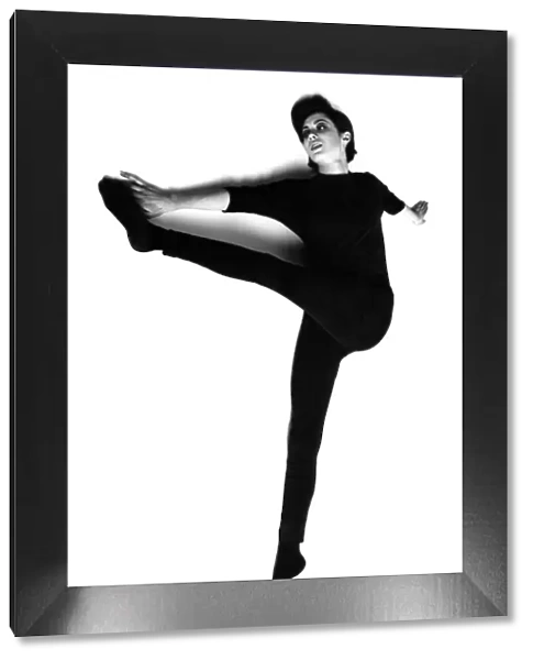 Slimming - Exercises 1960s. Woman performing stretches. Circa 1966