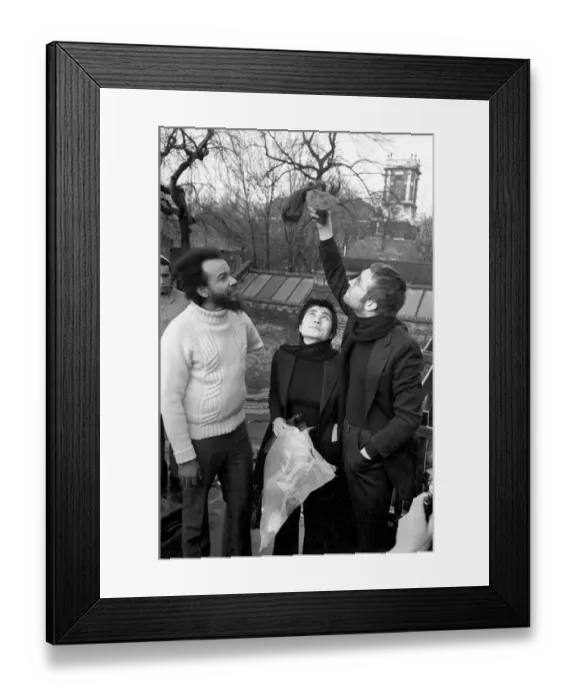 Framed Print : John Lennon and Yoko pictured on the roof of Black House in Holloway Road, with Michael X
