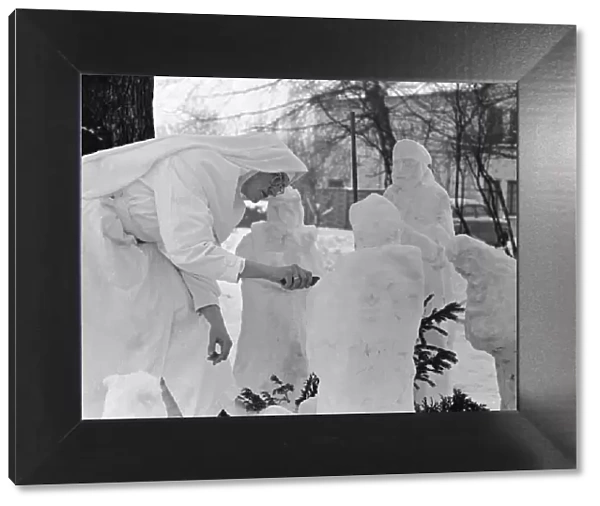 Nun at a Basildon convent creates a nativity scene from snowmen. December 1963