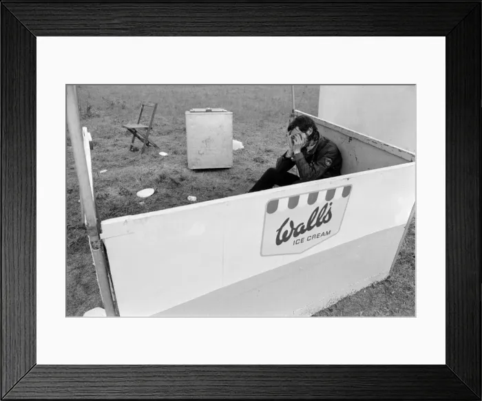 Framed Print : A music fan looking worse for wear at the Bath Festival of Blues & Progressive Music