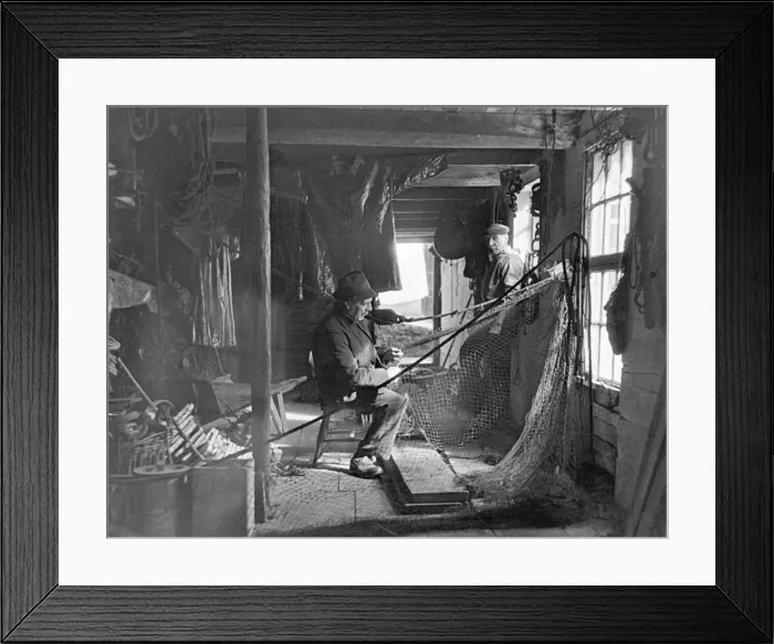 Framed Print : The fisherman peacefully mending his nets. During the rough weather the fishermen of St Framed Print : The fisherman peacefully mending his nets. During the rough weather the fishermen of St