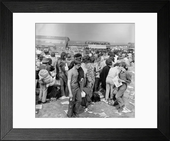 Framed Print : Music fans leaving The Isle of Wight Festival. 30th August 1970 Framed Print : Music fans leaving The Isle of Wight Festival. 30th August 1970