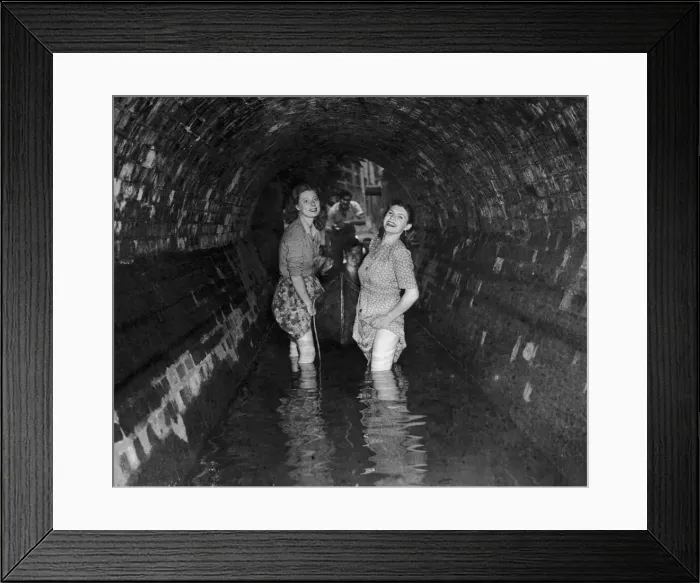 Framed Print : An Oxford undergraduate student being pulled along in a boat by two girls during an Framed Print : An Oxford undergraduate student being pulled along in a boat by two girls during an