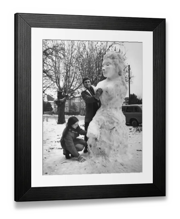 Framed Print : American graduate student Ken Donney and his wife Jill seen with giant snow woman they Framed Print : American graduate student Ken Donney and his wife Jill seen with giant snow woman they