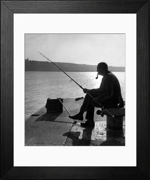 Framed Print : Fishing - Major R. E. Vargas of Pontypridd sits at the entrance to Cardiff Docks for a Framed Print : Fishing - Major R. E. Vargas of Pontypridd sits at the entrance to Cardiff Docks for a