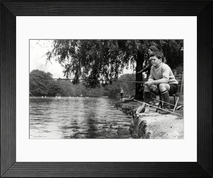 Framed Print : Concentration and determination reflected on the faces of these young fishermen enjoying