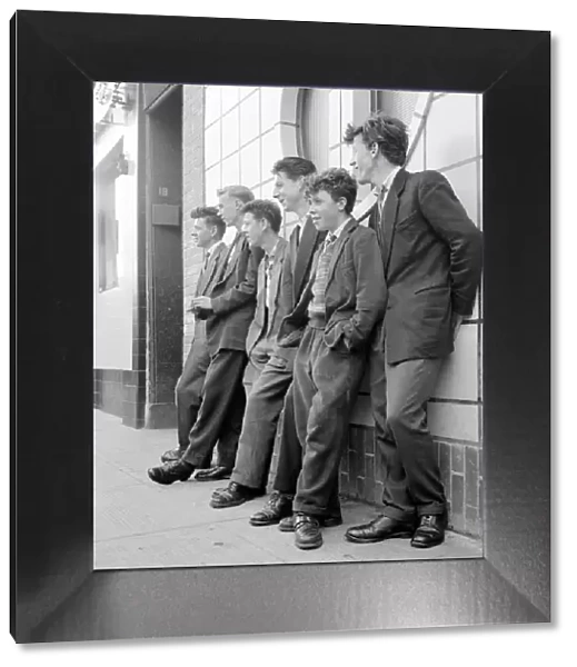 Teenage boys seen here leaning against the wall of the local coffee bar in Govan, Glasgow