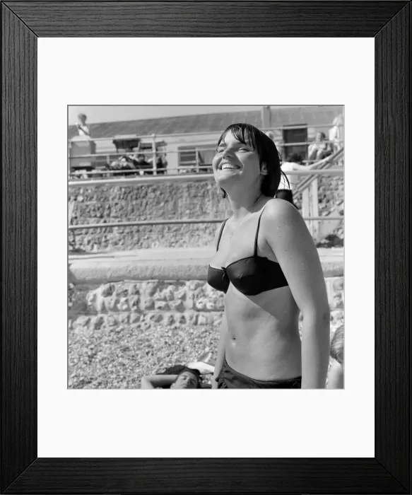 Framed Print : Summer scenes at Bognor Regis, West beach. 16 year old student Inga enjoying Framed Print : Summer scenes at Bognor Regis, West beach. 16 year old student Inga enjoying