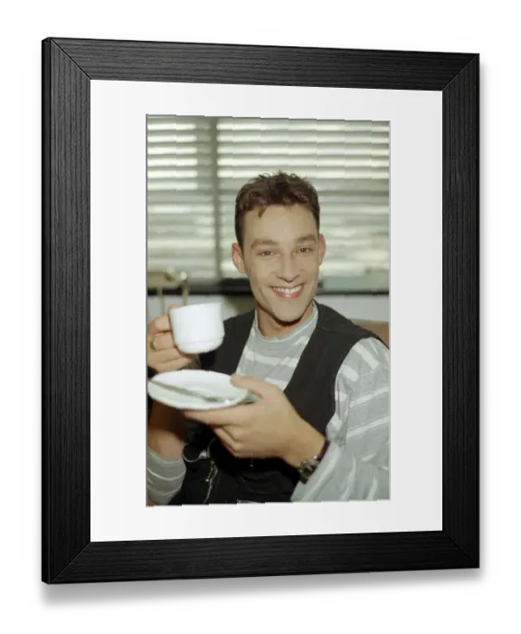 Framed Print : Radio DJ Toby Anstis drinking a cup of tea at The BBC in the Childrens BBC studio Framed Print : Radio DJ Toby Anstis drinking a cup of tea at The BBC in the Childrens BBC studio