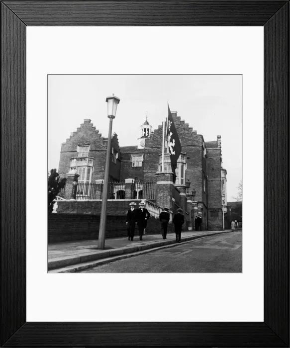 Framed Print : harrow schoolboys wearing their school uniform pass by the side of the college