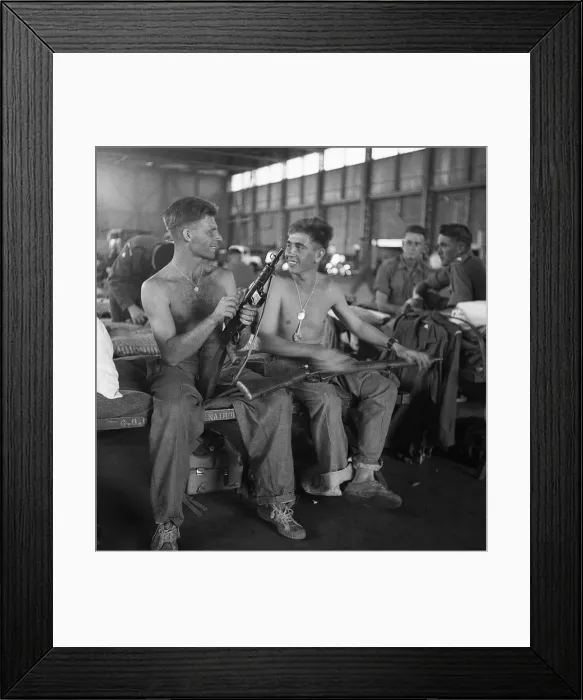 Framed Print : Men of the Lancashire Fusiliers camped in a hanger in Nairobi clean their weapons Framed Print : Men of the Lancashire Fusiliers camped in a hanger in Nairobi clean their weapons