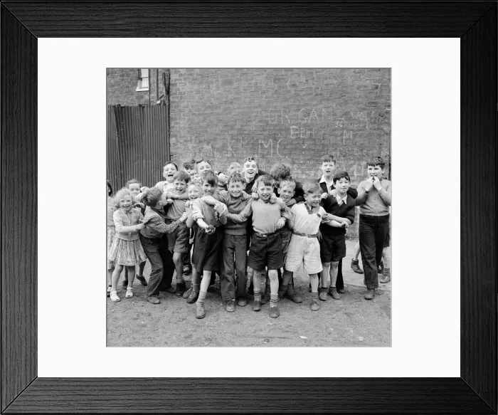 Framed Print : Children of the tenement blocks of Govan, Glasgow seen here posing for the camera Framed Print : Children of the tenement blocks of Govan, Glasgow seen here posing for the camera
