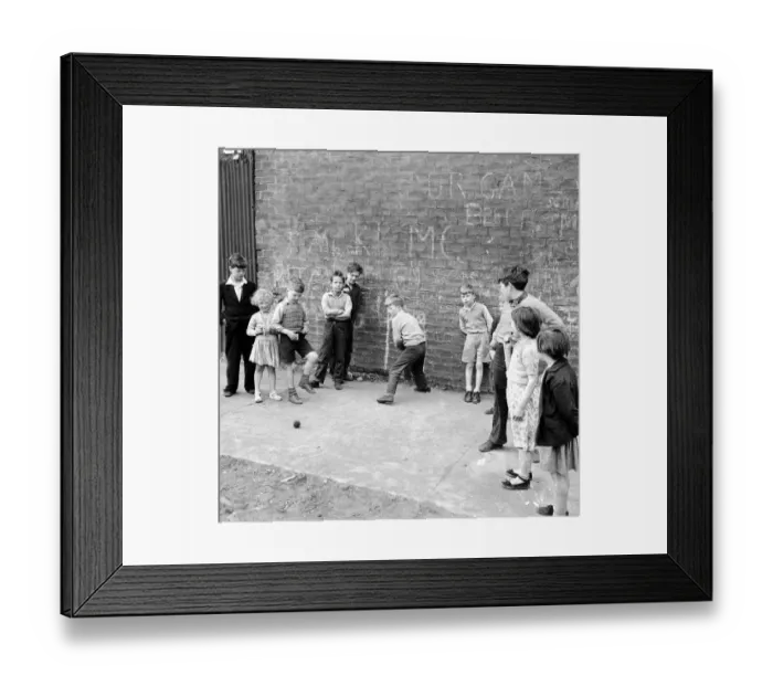 Framed Print : Children of the tenement blocks of Govan, Glasgow seen here playing a game of street Framed Print : Children of the tenement blocks of Govan, Glasgow seen here playing a game of street