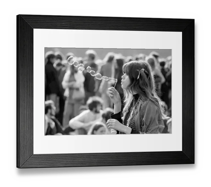 Framed Print : A hippy girl blowing bubbles at a pop concert in Hyde park, London June 1969