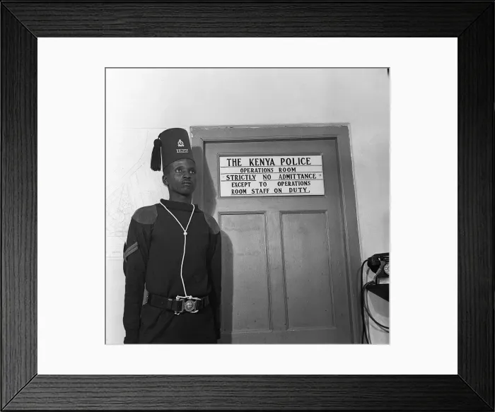 Framed Print : A guard at the Operations Room of the Kenya Police in Niarobi where the battle against Framed Print : A guard at the Operations Room of the Kenya Police in Niarobi where the battle against