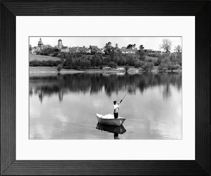 Framed Print : Angling. The village of Thurlaston gazes down on Draycote Water on a balmy day in May