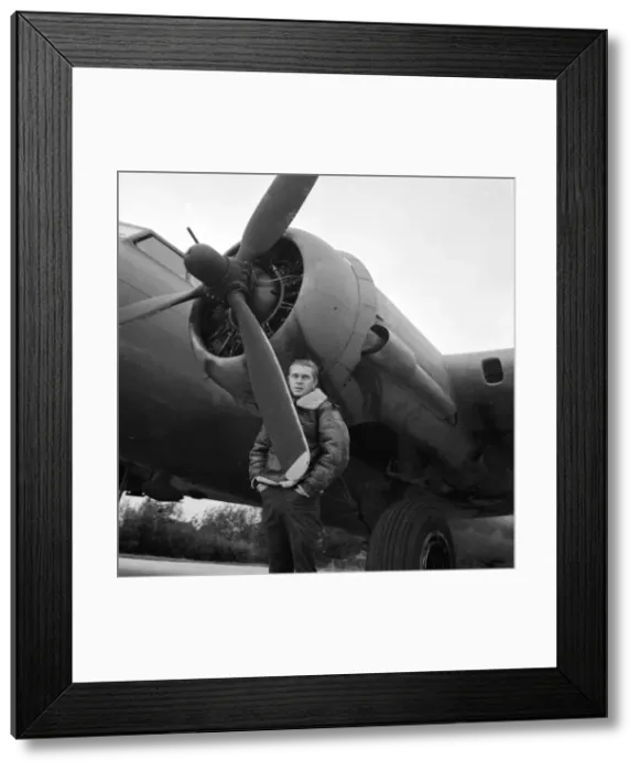 Framed Print : American actor Steve McQueen wearing a fur collared leather flying jacket as he stands Framed Print : American actor Steve McQueen wearing a fur collared leather flying jacket as he stands
