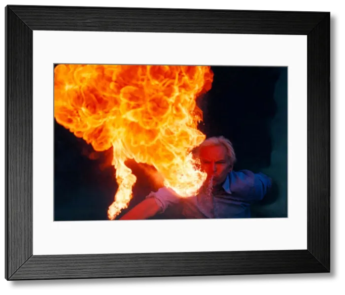 Framed Print : A fire eater performing in 1996 Framed Print : A fire eater performing in 1996