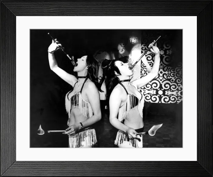 Framed Print : Lesley Hamilton and Gina Beck, a go-go dancer and fire eating act has won them a place in Framed Print : Lesley Hamilton and Gina Beck, a go-go dancer and fire eating act has won them a place in
