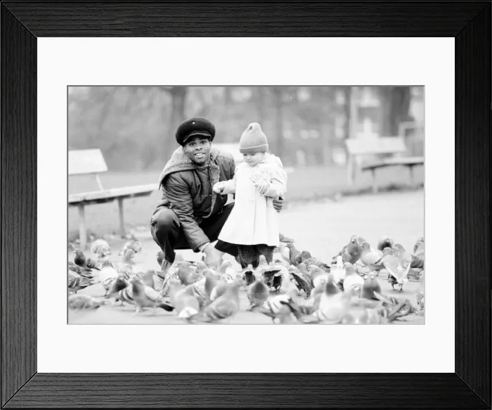 Framed Print : Boxer Kirkland Laing seen here with his child. 2nd December 1987 Framed Print : Boxer Kirkland Laing seen here with his child. 2nd December 1987