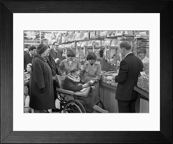 Framed Print : Woolworths, Rugby. Staff stay on to assist disabled shoppers with their Christmas