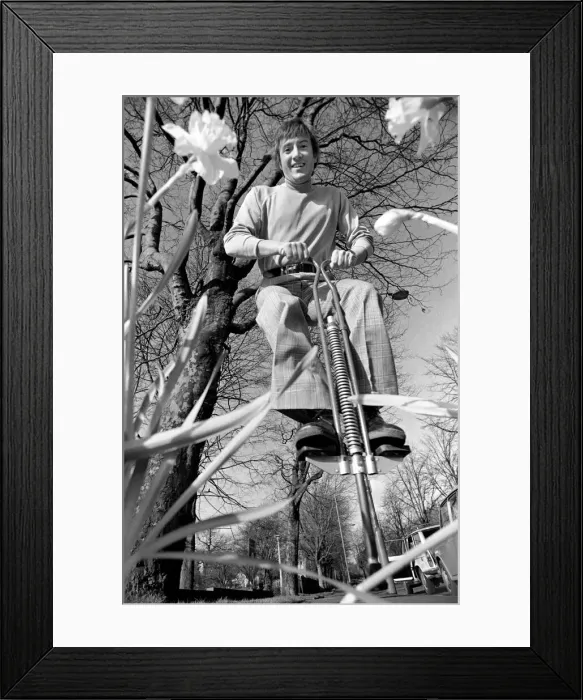 Framed Print : Roy Castle on a pogo stick. January 1975 75-00573-002 Framed Print : Roy Castle on a pogo stick. January 1975 75-00573-002