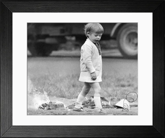 Framed Print : A young girl risks injury playing with fire on wasteland 01 / 11 / 72circa Framed Print : A young girl risks injury playing with fire on wasteland 01 / 11 / 72circa