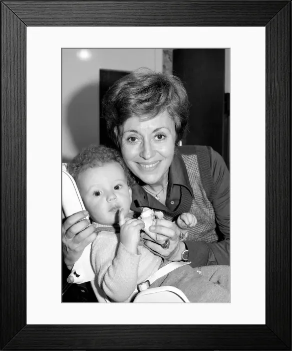 Framed Print : International singer star: Caterina Valente serenades her son. February 1975 75-00827-006 Framed Print : International singer star: Caterina Valente serenades her son. February 1975 75-00827-006