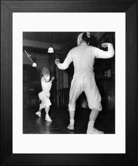 Framed Print : Fencing coaching: Muriel Bridges a coach overreaches with her lunge and is disarmed by Dr Framed Print : Fencing coaching: Muriel Bridges a coach overreaches with her lunge and is disarmed by Dr