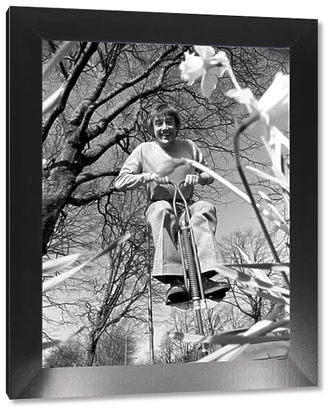 Roy Castle on a pogo stick. January 1975 75-00573-004