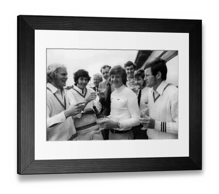Framed Print : Glenn Turner (NZ) celebrates with champagne his 1, 000 runs before the end of May