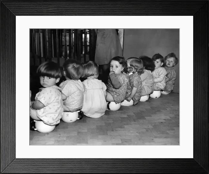 Framed Print : War-time Day Nursery at Watford: Potting time, or mind your own business Framed Print : War-time Day Nursery at Watford: Potting time, or mind your own business