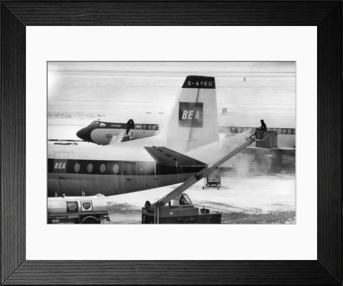 Framed Print : Snow Clearance at London Airport (Heathrow). BEA Aircraft being de-A Revolutionary