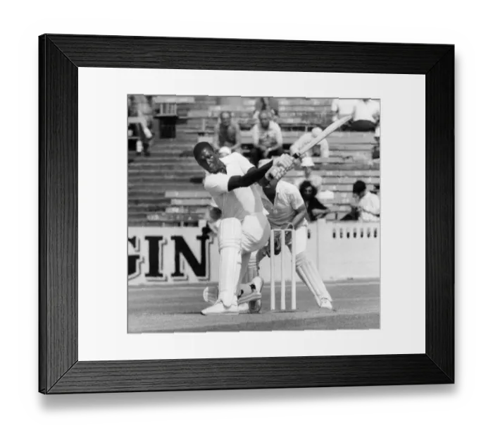 Framed Print : Lancaster. vs. Somerset. Joel Garner hits the ball out of the ground at Old Trafford with Framed Print : Lancaster. vs. Somerset. Joel Garner hits the ball out of the ground at Old Trafford with