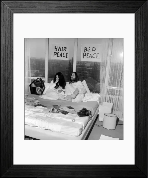 Framed Print : Pictured on their honeymoon'bed newly weds. John Lennon
