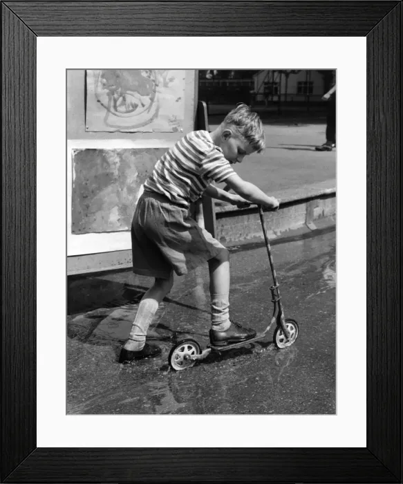 Framed Print : Toys Cycles and Scooters: One way to keep cool is to use the children Framed Print : Toys Cycles and Scooters: One way to keep cool is to use the children
