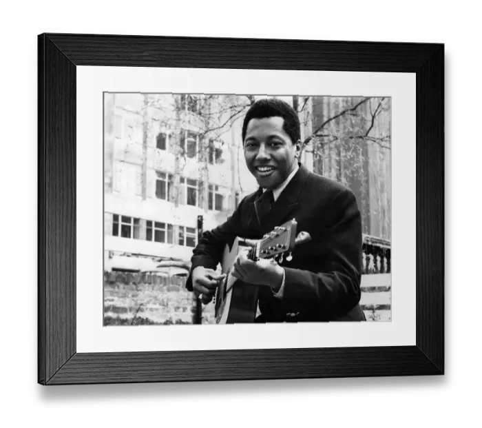 Framed Print : Labi Siffre with his guitar in a City Garden. May 1970 P005510 Framed Print : Labi Siffre with his guitar in a City Garden. May 1970 P005510