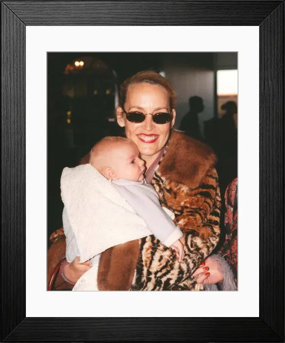 Framed Print : Jerry Hall with baby Gabriel March 1998 At Heathrow Airport Framed Print : Jerry Hall with baby Gabriel March 1998 At Heathrow Airport