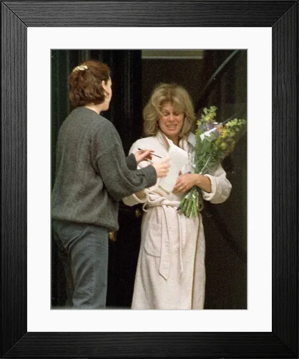 Framed Print : Joanna Lumley at home receiving flowers from the Daily Mirror Framed Print : Joanna Lumley at home receiving flowers from the Daily Mirror