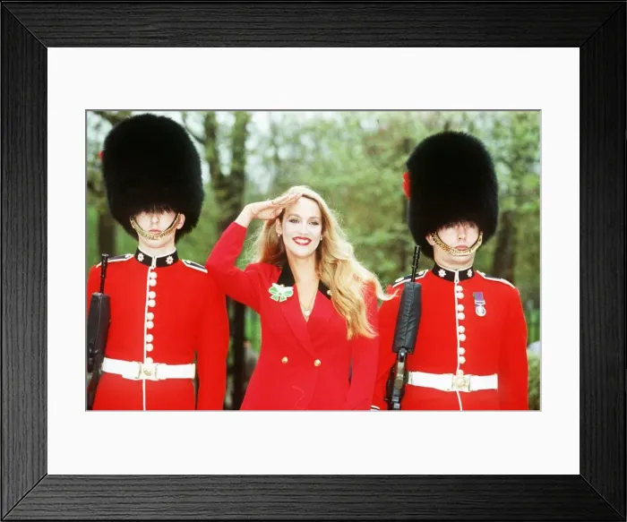 Framed Print : Jerry Hall Model with two Buckingham Palace guards to launch a charity appeal Framed Print : Jerry Hall Model with two Buckingham Palace guards to launch a charity appeal