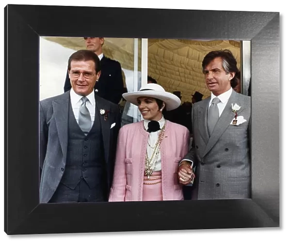 Roger Moore Actor James Bond with and George Hamilton at the Epsom Derby