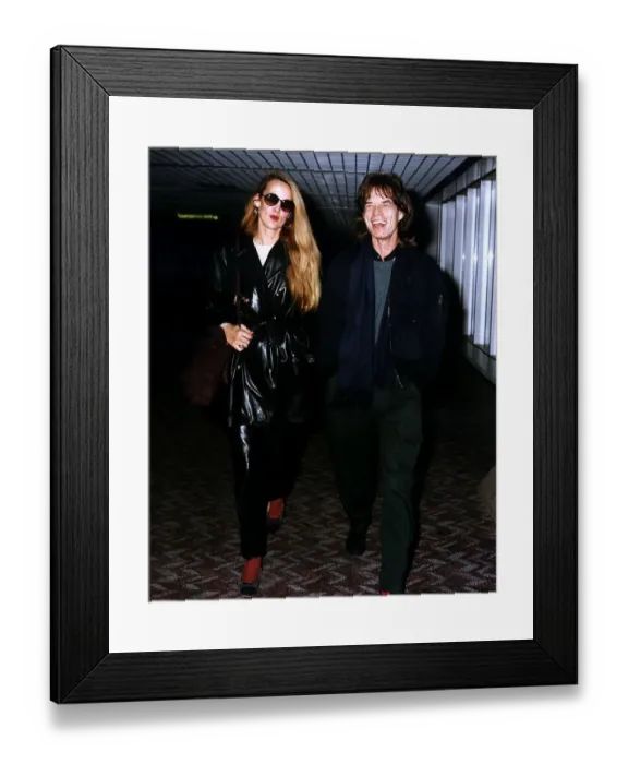 Framed Print : Jerry Hall and Mick Jagger at Heathrow Airport. February 1993 Framed Print : Jerry Hall and Mick Jagger at Heathrow Airport. February 1993