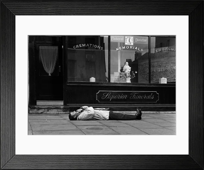 Framed Print : Spike Milligan comedian March 1963 prostate outside an Islington undertakers Framed Print : Spike Milligan comedian March 1963 prostate outside an Islington undertakers
