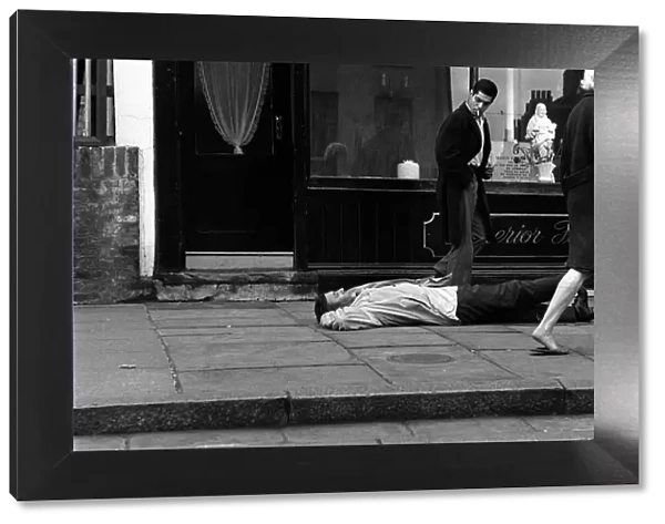 Spike Milligan March 1963 comedian prostrate outside an Islington undertakers