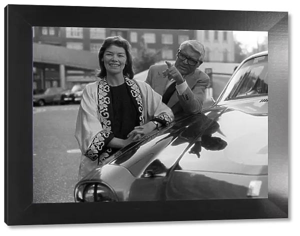 Cary Grant and Glenda Jackson standing beside car 5  /  6  /  75