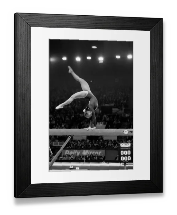 Framed Print : Competitor on the beam in the Champions All'Gymnastics Competition