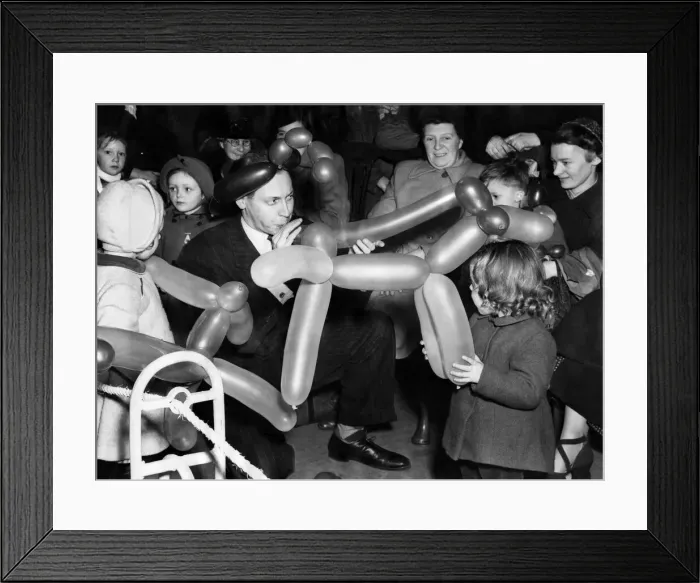 Framed Print : Disney entertainer Wally Boag enjoys the fun of delighting small children with his Framed Print : Disney entertainer Wally Boag enjoys the fun of delighting small children with his