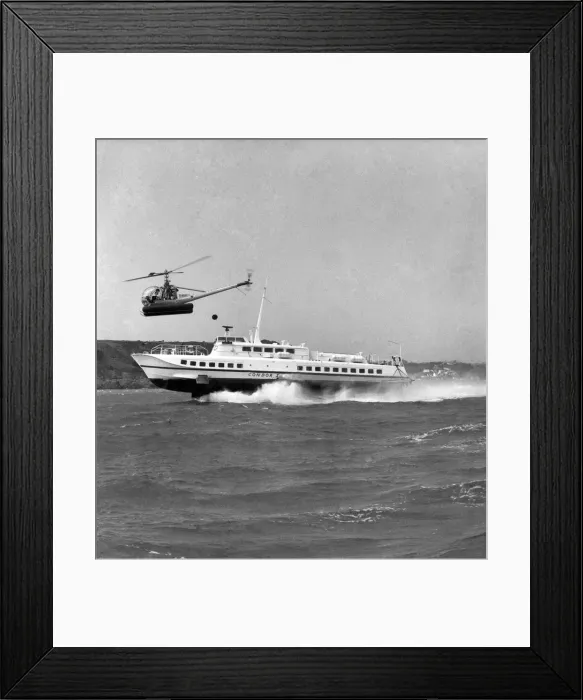 Framed Print : The Hydrofoil Condor 1 at sea of Jersey, overhead is a small helicopter Framed Print : The Hydrofoil Condor 1 at sea of Jersey, overhead is a small helicopter