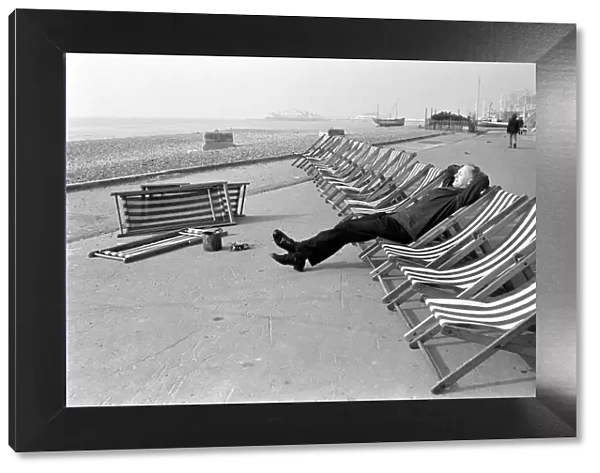 Deck chair tester Ernie Snelling. Its hard work down at the seaside doing the deck chair